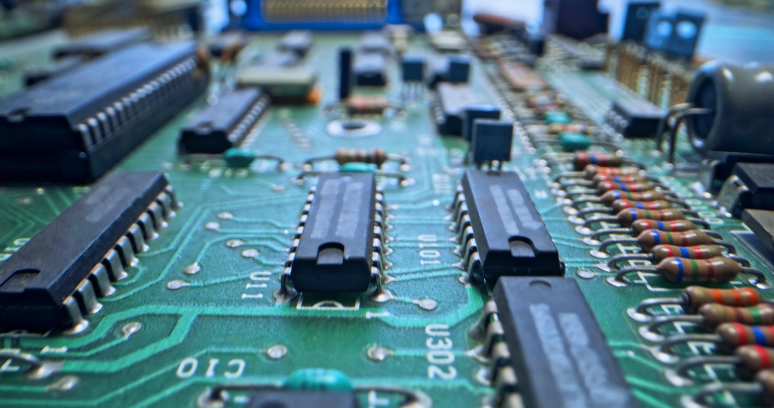 Technician workbench view of a motherboard and components